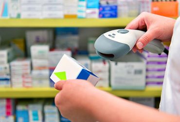 Pharmacist scanning prescription barcode scanner