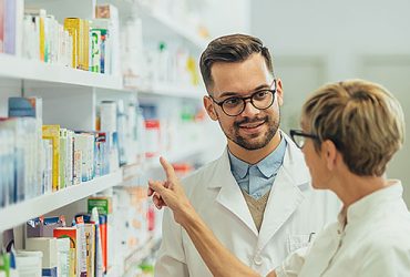 Two pharmacists talking about inventory