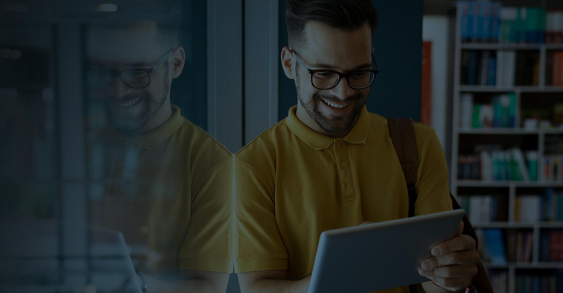 SykesMediaResourcesBanner Man using tablet and smiling