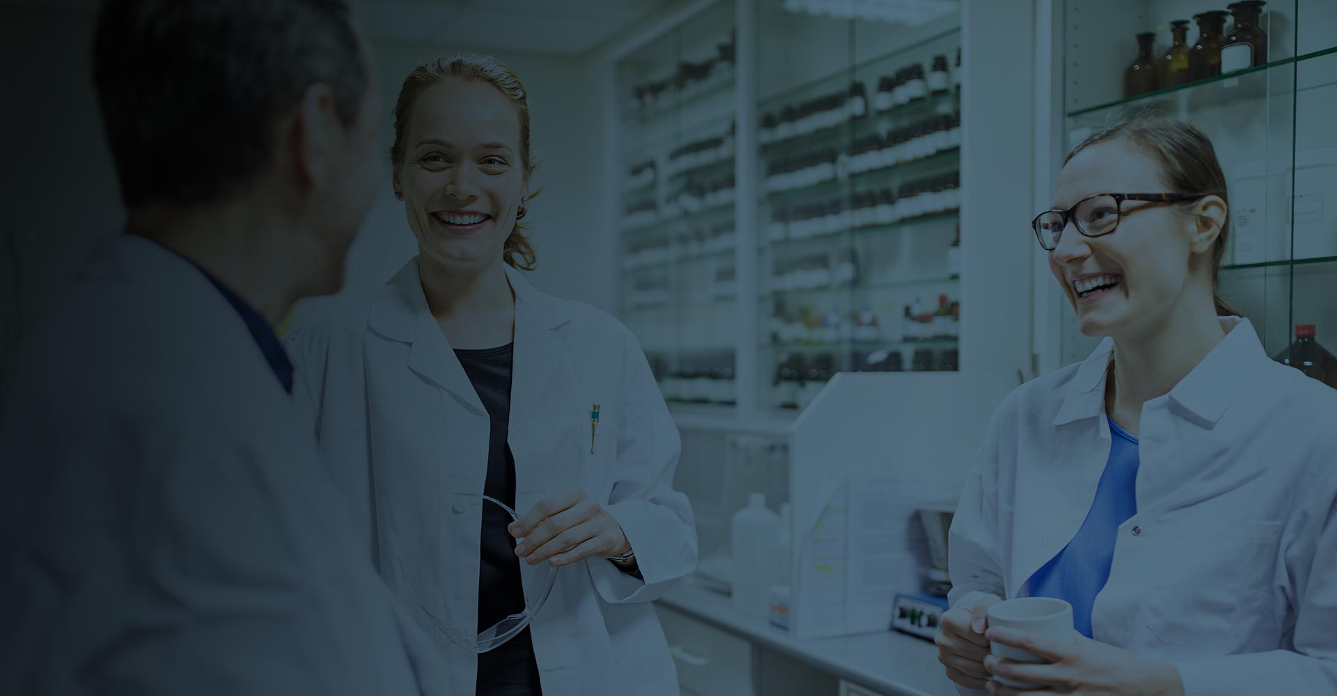 SykesTeamBanner Smiling pharmacists talking together