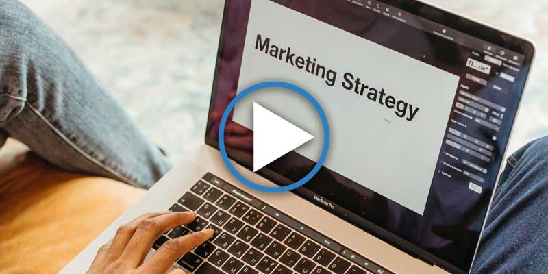 Laptop with words "Marketing Strategy" on the screen
